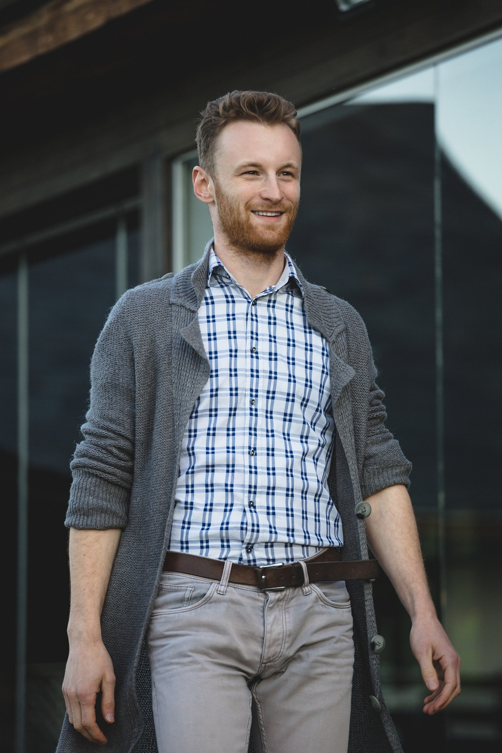 Man in button down shirt and sweater